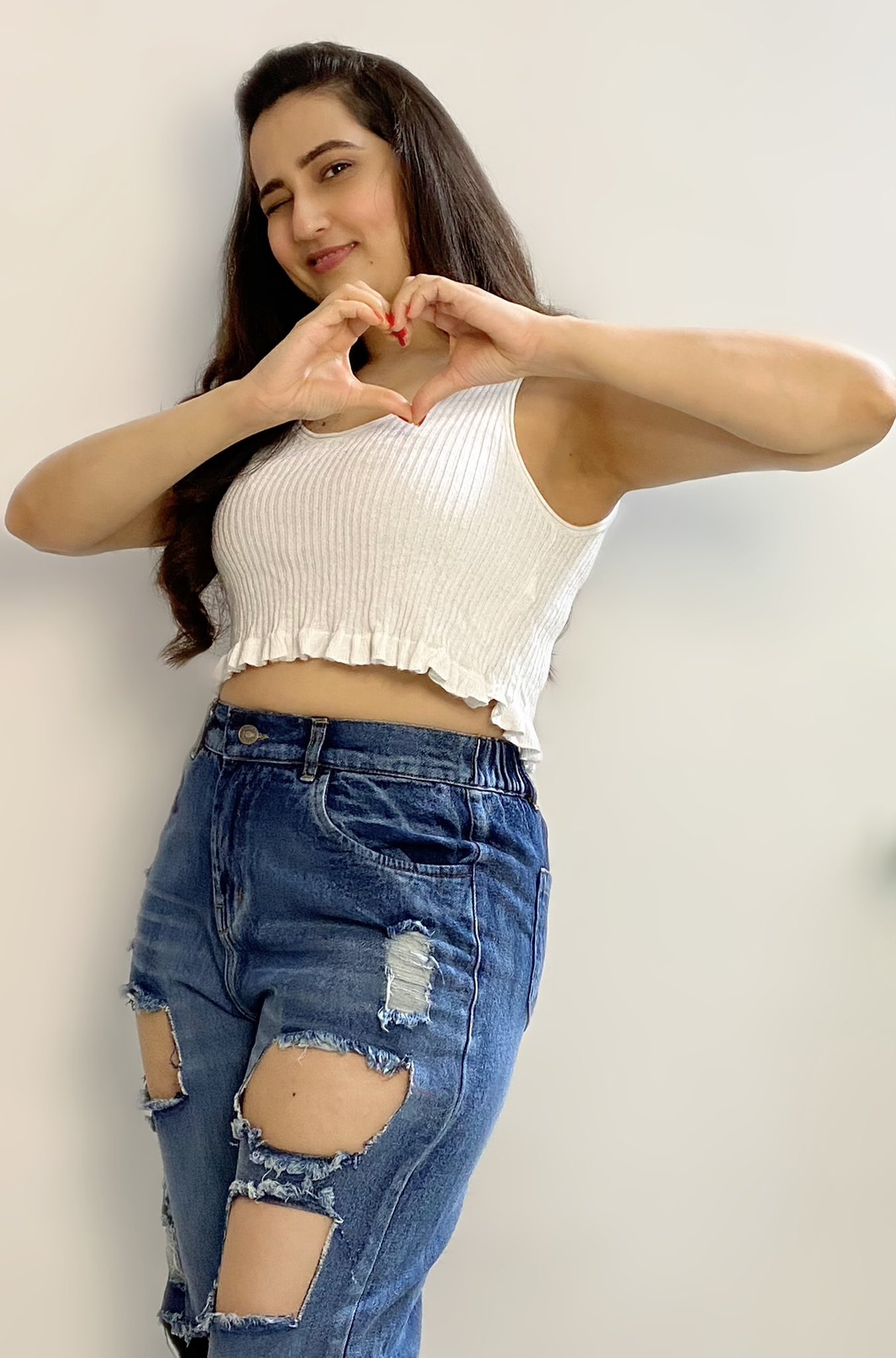 MANJUSHA hot poses in white smocked crop top and ripped jeans