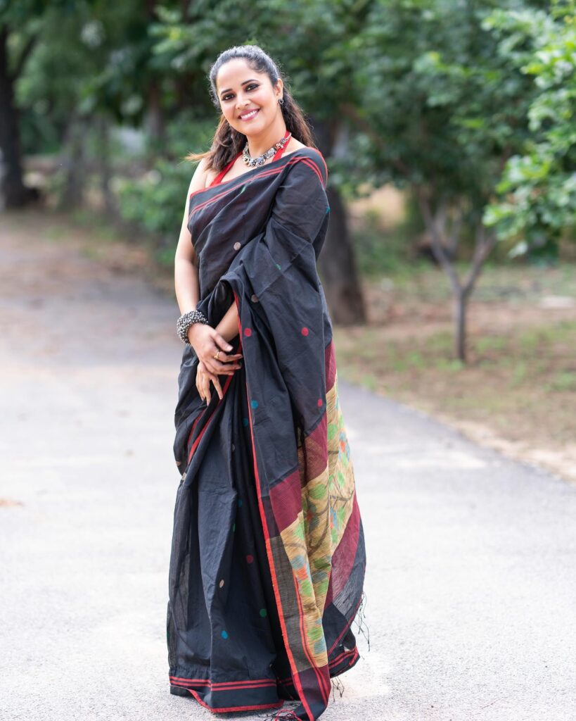 Hot And Sensual Anchor Anasuya Bhardwaj Stills In Black Color Saree Glam Actress