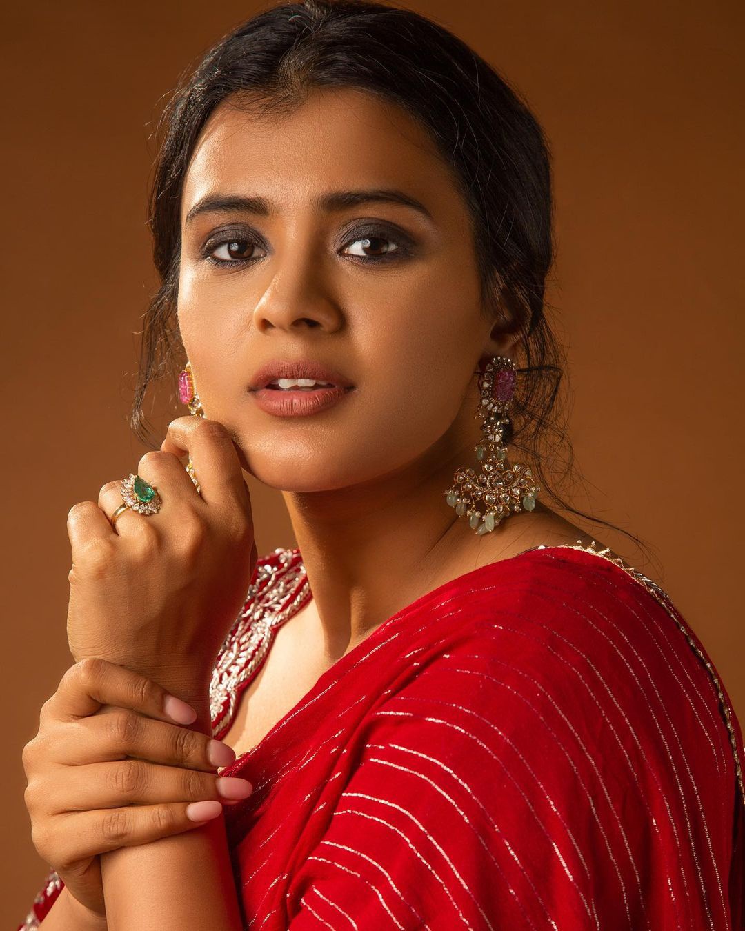 Hebbah Patel stills in red color saree