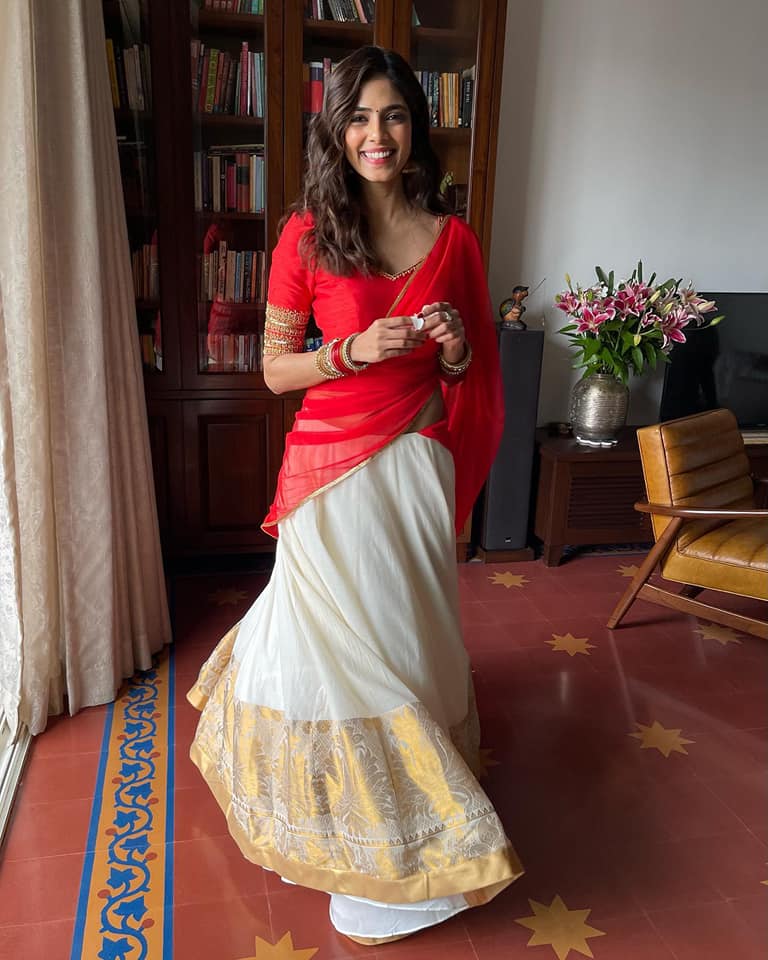 Onam Special: Malavika Mohanan stills in red color half saree