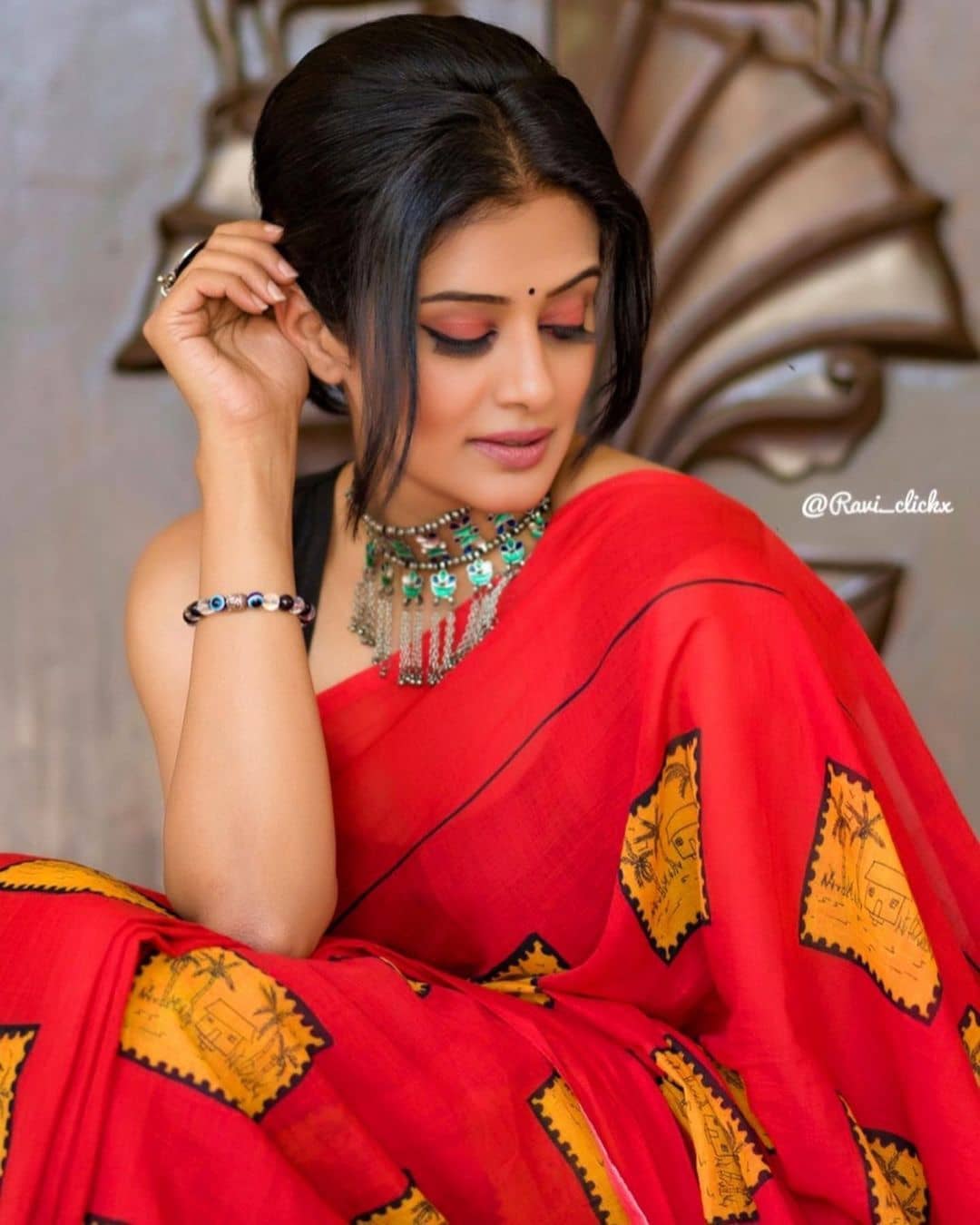 Priyamani latest stills in red saree