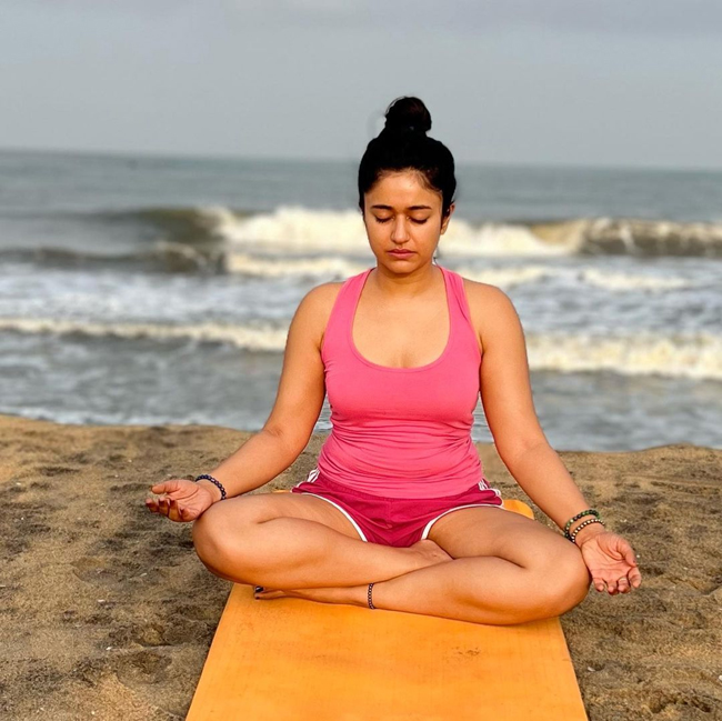 Poonam Bajwa stills during her yoga workout at beach
